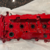 A custom painted Acura/Honda OEM valve cover for a K20C1 engine.